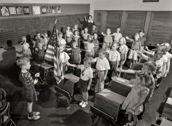 September 1942. Rochester, New York. "Earl Babcock's school day begins with the salute to the flag." A few interpretations verging on Jazz Hands. 4x5 inch nitrate negative by Ralph Amdursky for the Office of War Information. View full size.