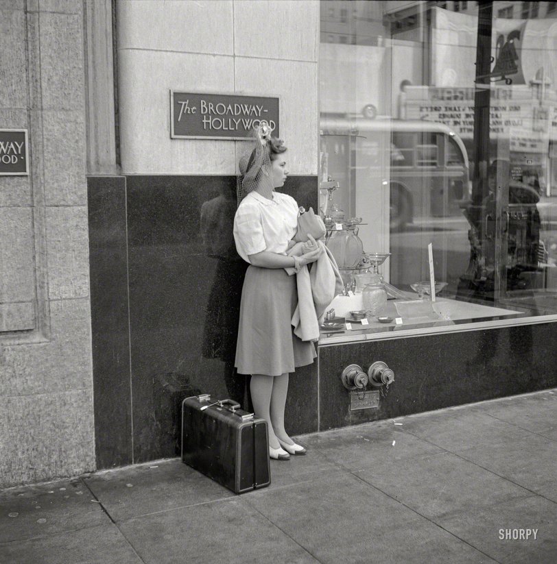 April 1942. "Hollywood, California. Girl on the street." Note the aspirational hat. Photo by Russell Lee for the Office of War Information. View full size.
