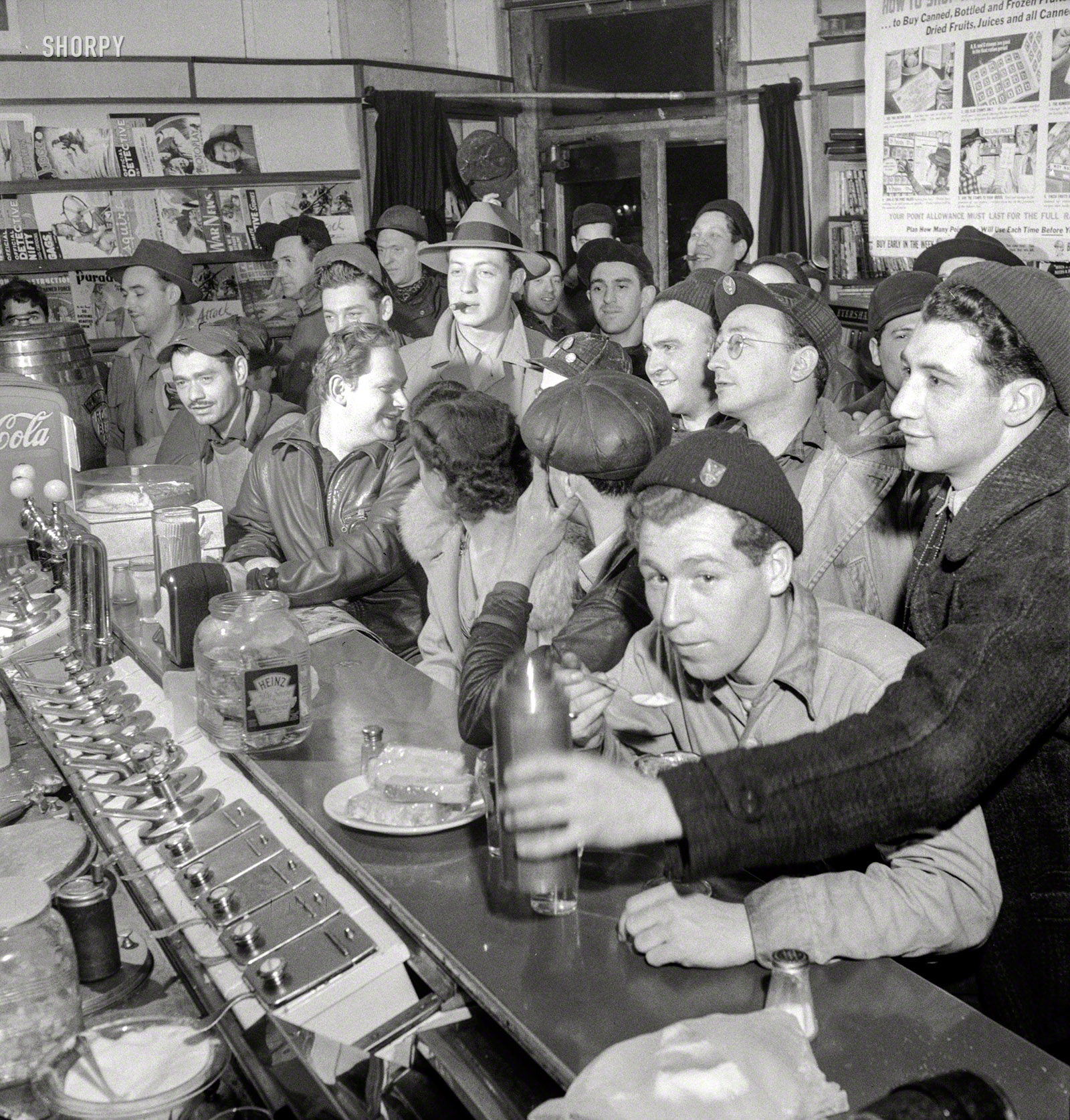 &nbsp; &nbsp; &nbsp; &nbsp; "We'll have what she's having."
April 1943. "Baltimore, Maryland. Third-shift defense workers getting snack at drugstore on corner where their shared car will pick them up around midnight." Photo by Marjory Collins for the Office of War Information. View full size.