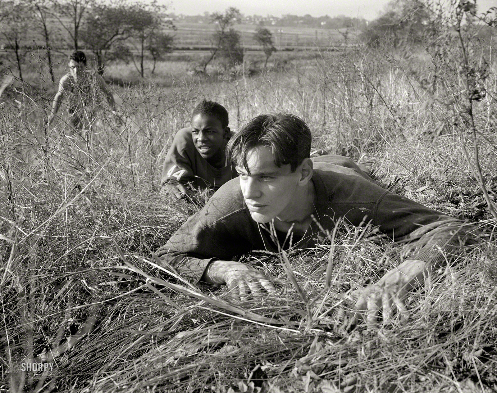 October 1942. "High school Victory Corps. Learning the rudiments of advancing on an enemy will prove valuable to these boys if they are called to join their older brothers in the armed forces. This is part of the 'commando' training given in physical education courses at Flushing High School, Queens, New York." Photo by William Perlitch for the Office of War Information. View full size.