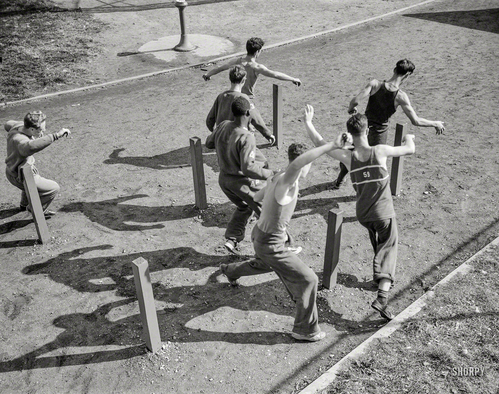 October 1942. "Benjamin Franklin High School, New York, New York. Victory Corps. High school boys growing physically fit through exercise." Medium format negative by William Perlitch for the Office of War Information. View full size.