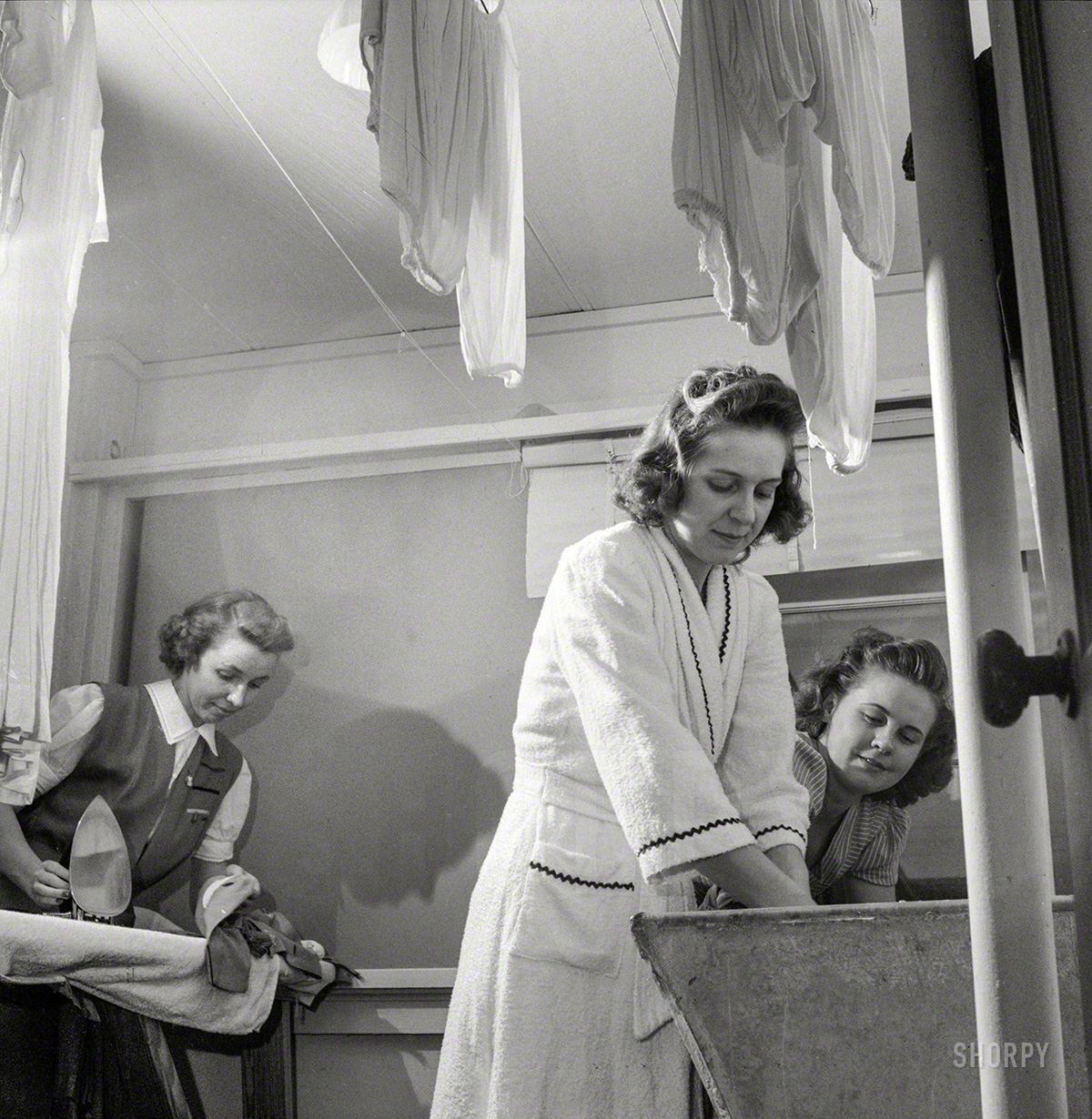 June 1943. "Arlington, Virginia. Washing clothes in one of the laundry rooms at Idaho Hall, Arlington Farms, war duration residence hall for women government workers." Photo by Esther Bubley, Office of War Information. View full size.