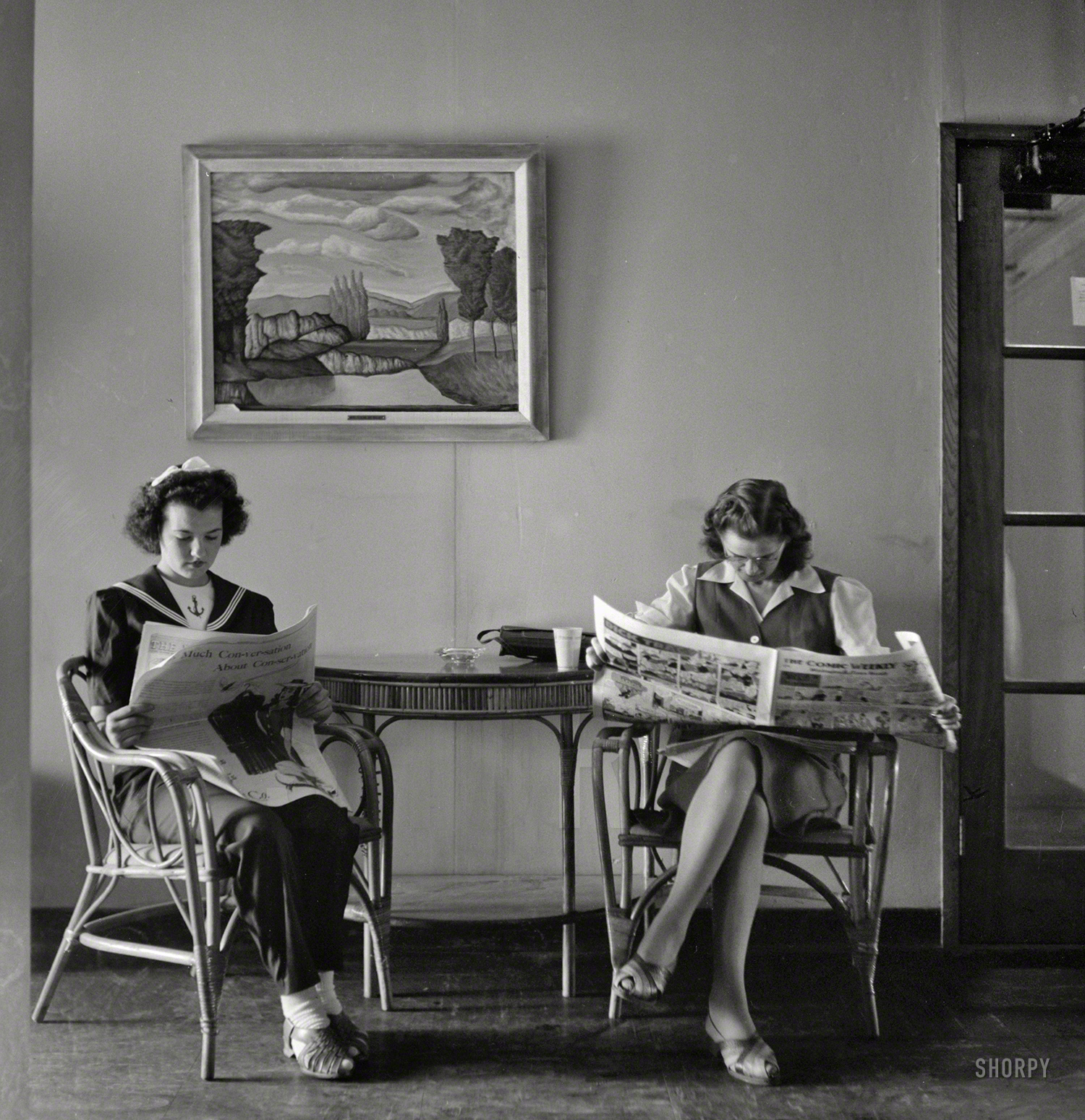 May 1943. Arlington, Virginia. "Reading the Sunday paper at Arlington Farms, duration residence halls for women war workers." Medium format nitrate negative by Esther Bubley for the Office of War Information. View full size.