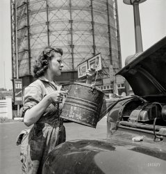 June 1943. "Miss Ruth Gusick, formerly a clerk in a drugstore, now works as a garage attendant at one of the Atlantic Refining Company service stations in Philadelphia." Photo by Jack Delano, Office of War Information. View full size.