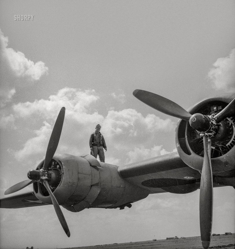 April 1943. "Airman on wing of B-24 bomber at U.S. Army 9th Air Force base somewhere in Libya." Nitrate negative by Nick Parrino for the Office of War Information. View full size.