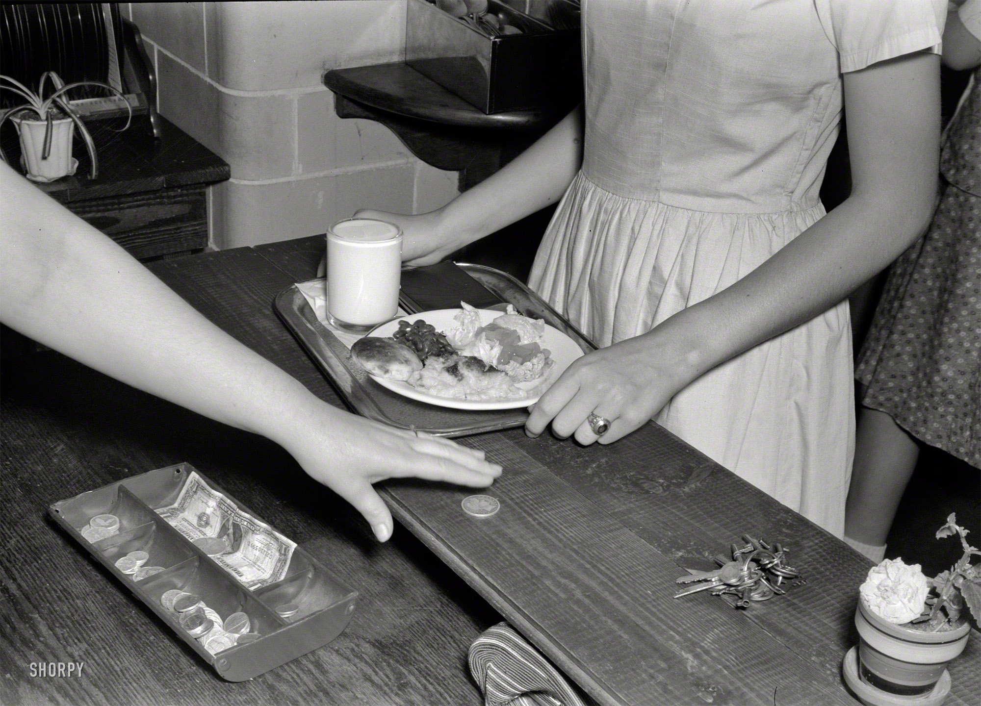 May 1943. "Keysville, Virginia. Randolph Henry High School cafeteria. Typical lunch for 15 cents: candied yams, macaroni and cheese, fruit salad, deviled eggs, dessert and milk. Milk is free and children can have as much as they want." Photo by Philip Bonn for the Office of War Information. View full size.