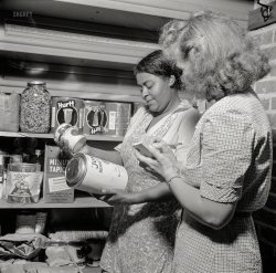 June 1943. New Britain, Connecticut. "A child care center opened September 15, 1942, for 30 children, ages 2 through 5, of mothers engaged in war industry. The hours are 6:30 a.m. to 6 p.m., six days per week. Miss Machmer and the dietitian checking the amount of food used during the month and making a general inventory of all supplies on hand." Medium format nitrate negative by Gordon Parks for the Office of War Information. View full size.
