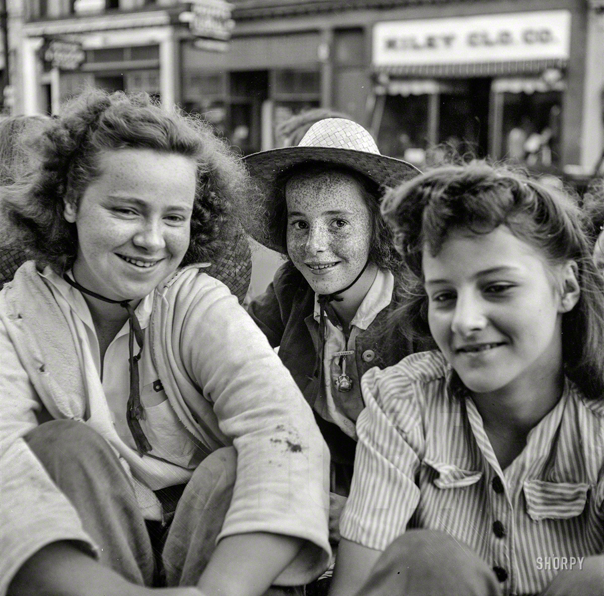 June 1943. Oswego, New York. "Children recruited for farm work during the summer, waiting to start for work outside the U.S. Employment Service." Photo by Marjory Collins for the Office of War Information. View full size.
