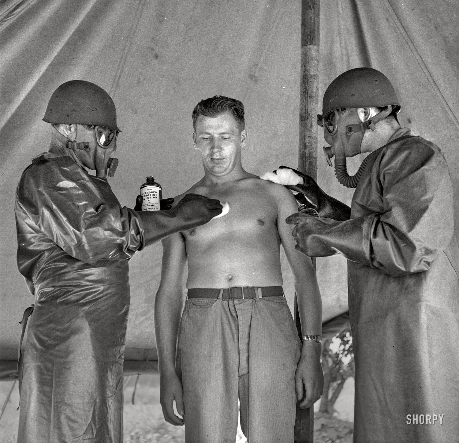 July 1943. "Greenville, South Carolina. Men of the medical unit of the 25th Service Group simulating the treatment of a gas casualty." Medium format nitrate negative by Jack Delano for the Office of War Information. View full size.