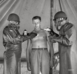 July 1943. "Greenville, South Carolina. Men of the medical unit of the 25th Service Group simulating the treatment of a gas casualty." Medium format nitrate negative by Jack Delano for the Office of War Information. View full size.