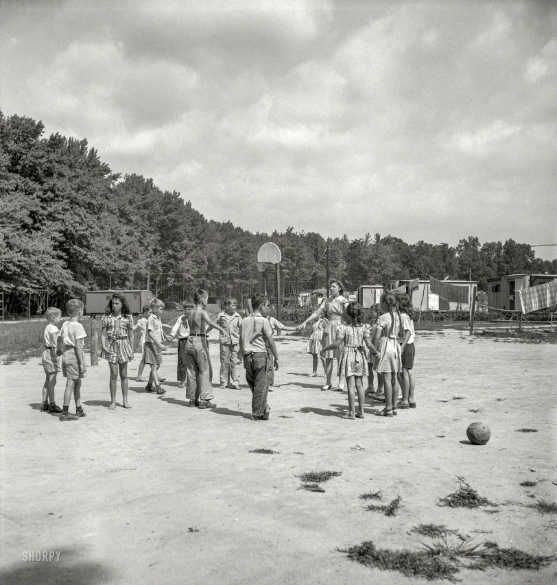 August 1943. "Middle River, a small crossroads in the vicinity of Baltimore, Maryland. Farm Security Administration housing project (later administered by the National Housing Agency) for Glenn L. Martin aircraft workers. Play period for children attending Bible class." Medium format negative by John Collier for the Office of War Information. View full size.
