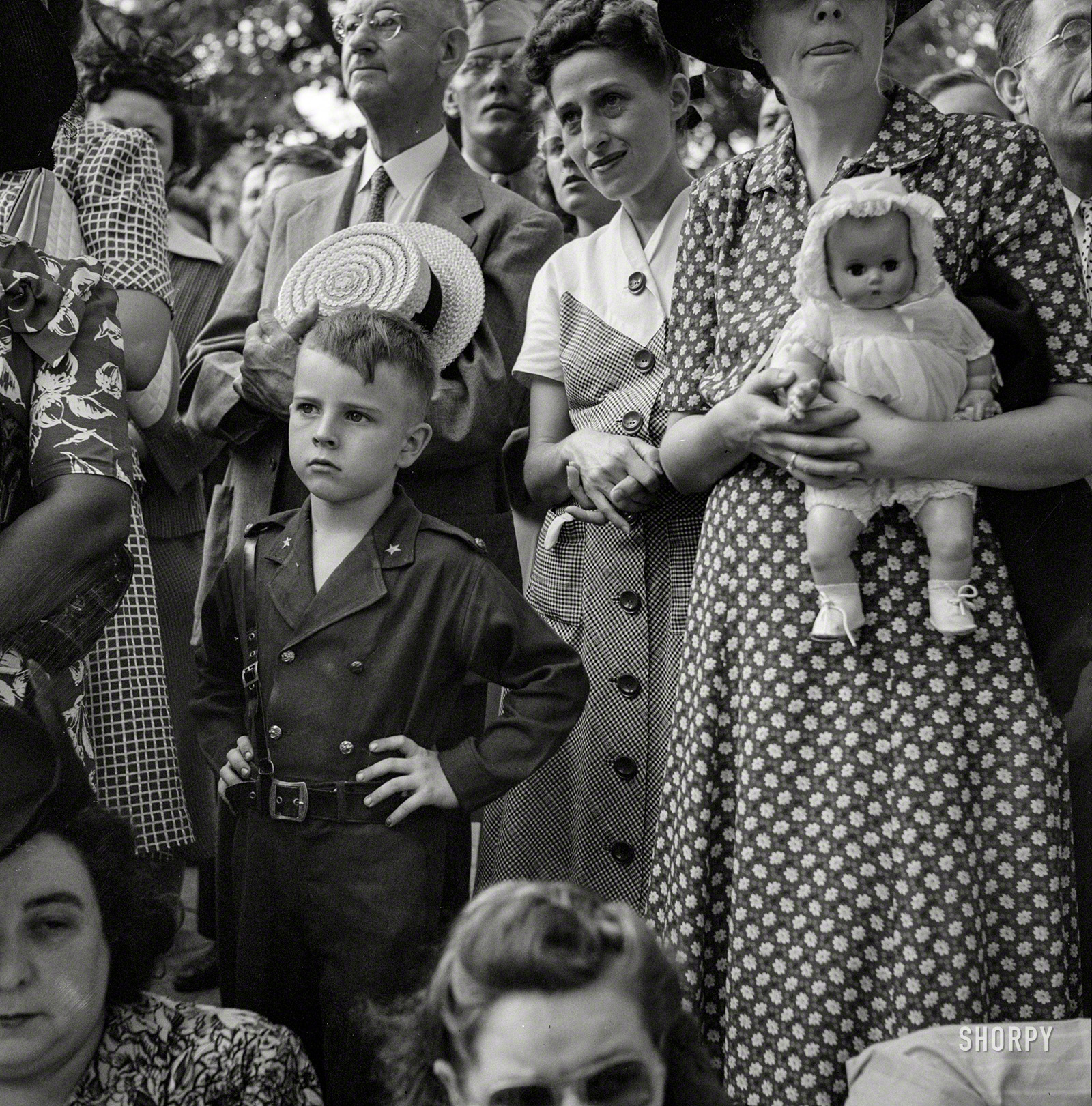 July 1943. Washington, D.C. "Spectators at Office of Civilian Defense parade to recruit civilian defense volunteers." Medium format negative by Esther Bubley for the Office of War Information. View full size.
