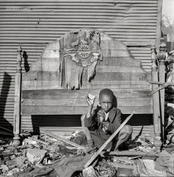 July 1943. Washington, D.C. "A child whose home is an alley dwelling near the U.S. Capitol." Photo by Esther Bubley, Office of War Information. View full size.