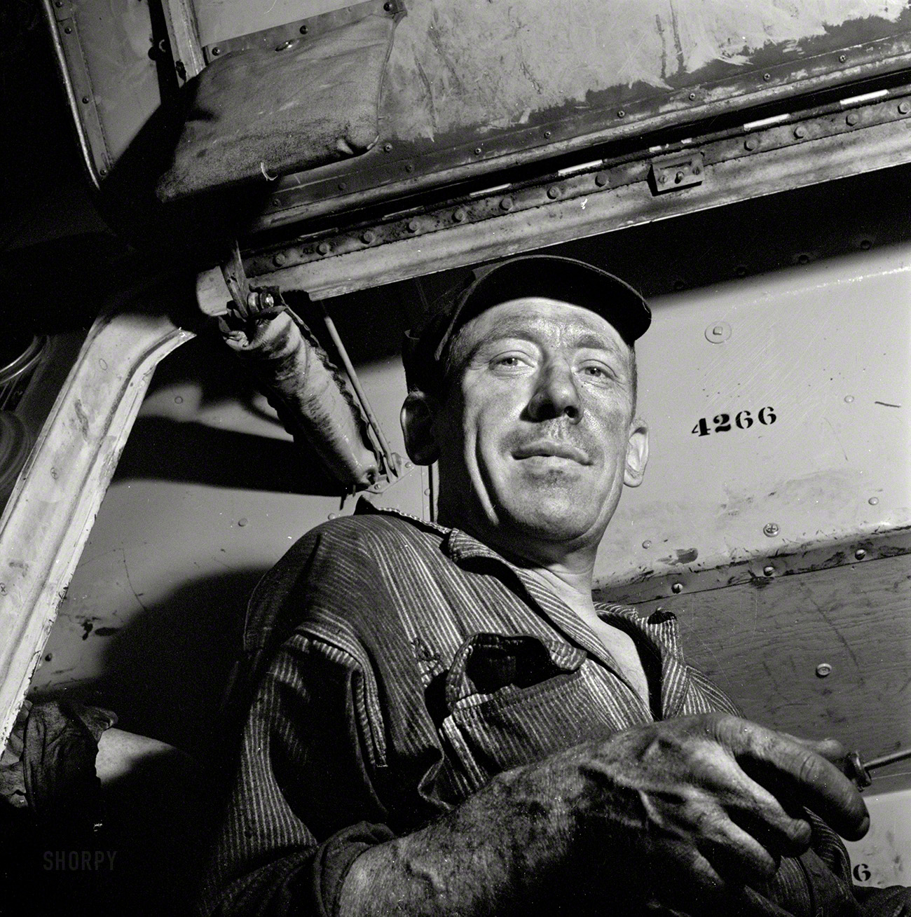September 1943. Pittsburgh, Pennsylvania. "A mechanic at the Greyhound garage." Photo by Esther Bubley for the Office of War Information. View full size.