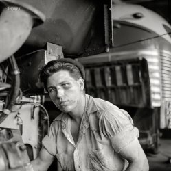 September 1943. Pittsburgh, Pennsylvania. "Mechanic in the Greyhound bus garage." Photo by Esther Bubley, Office of War Information. View full size.