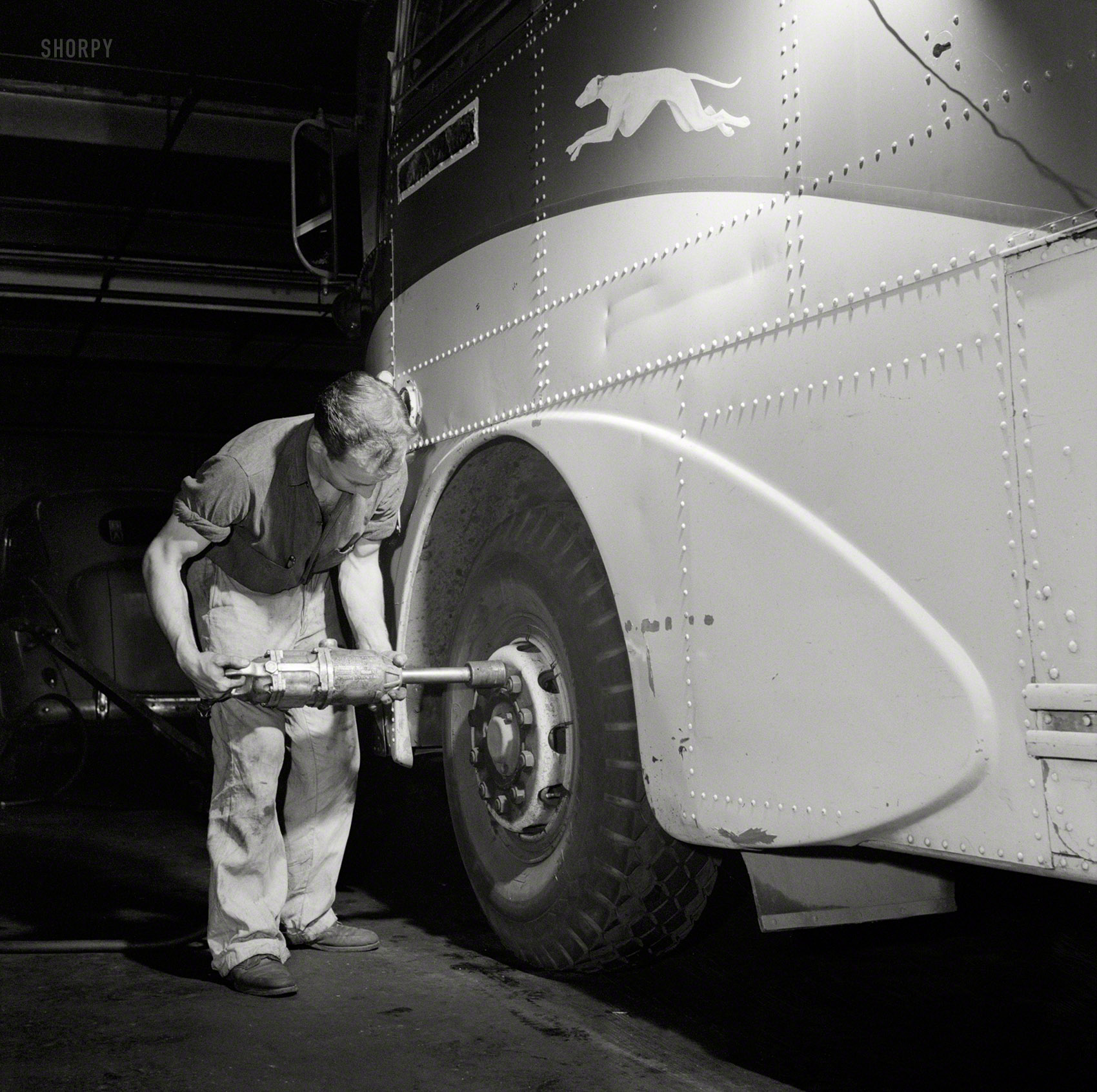 September 1943. "Pittsburgh, Pennsylvania. Removing a tire from a bus at the Greyhound garage." Office of War Information photo by Esther Bubley, that amanuensis of the motorcoach, whose hundreds of bus images rival Jack Delano's train photos in their breadth and number. View full size.