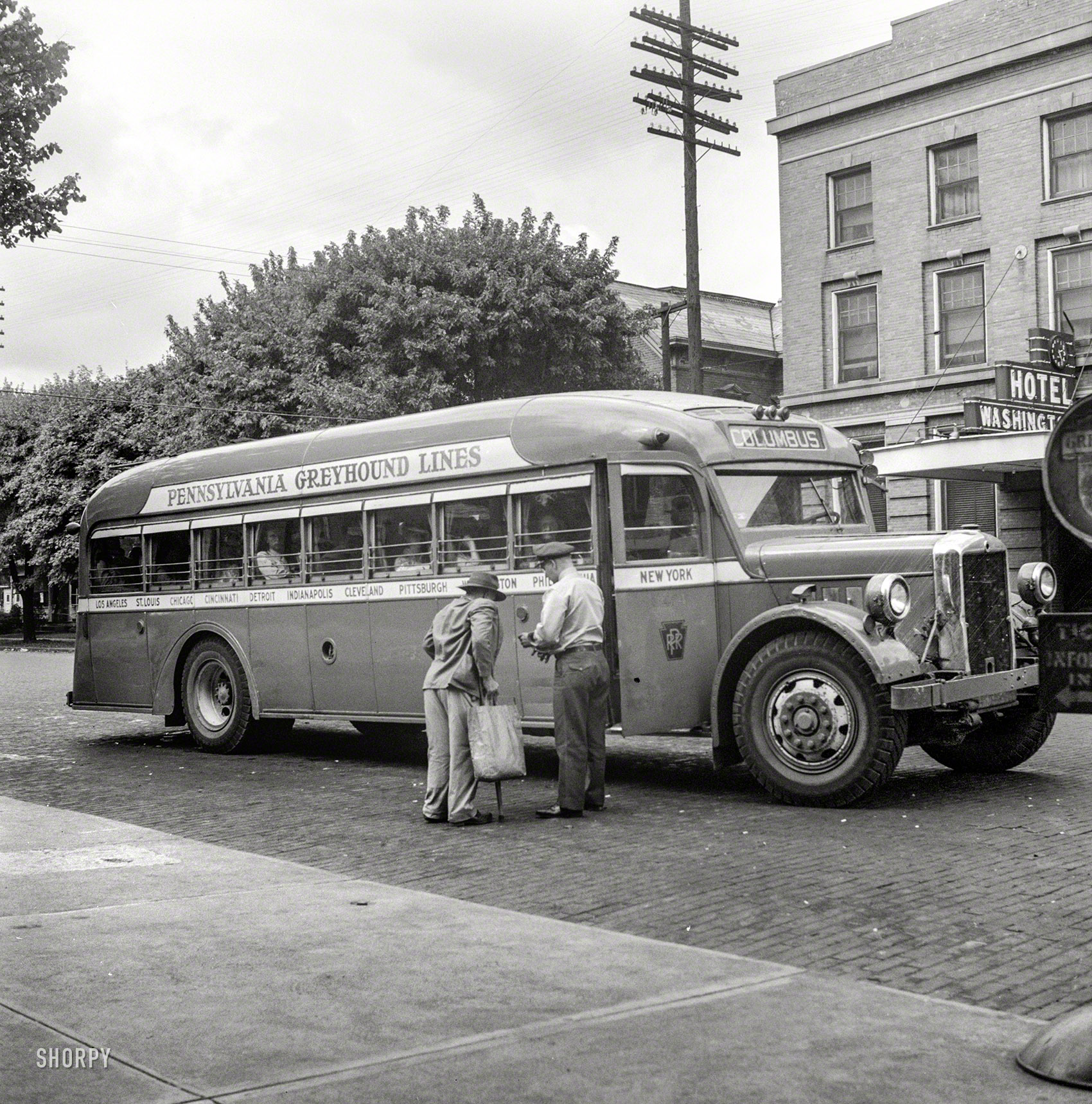 September 1943. "Washington Court House, Ohio. Passenger boarding Greyhound bus." Photo by Esther Bubley for the Office of War Information. View full size.