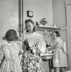 September 1943. Cincinnati, Ohio. "The children of Bernard Cochran, a Greyhound bus driver, doing dishes after Sunday dinner." Medium format negative by Esther Bubley for the Office of War Information. View full size.