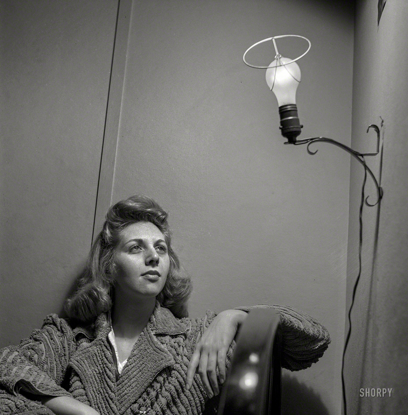 January 1943. Washington, D.C. "This Office of Price Administration clerk, speaking of her boardinghouse room, says: 'The light looks like an angel when I leave the shade off, so I do so'." Photo by Esther Bubley. View full size.