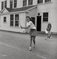 October 1943. Washington, D.C. "Sally Dessez, a student at Woodrow Wilson High School, playing a tennis match." Along with This Girl. Photo by Esther Bubley for the Office of War Information. View full size.