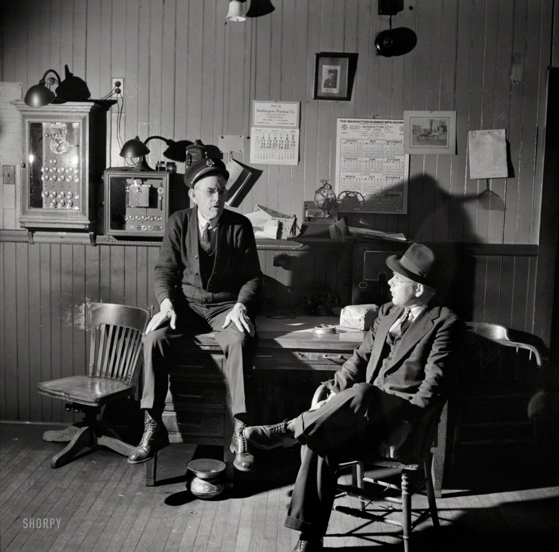 May 1942. Southington, Conn. "Thomas J. Murphy, chief of the fire department, and its only salaried member, chatting with one of the volunteers." Medium format negative by Fenno Jacobs for the Office of War Information. View full size.