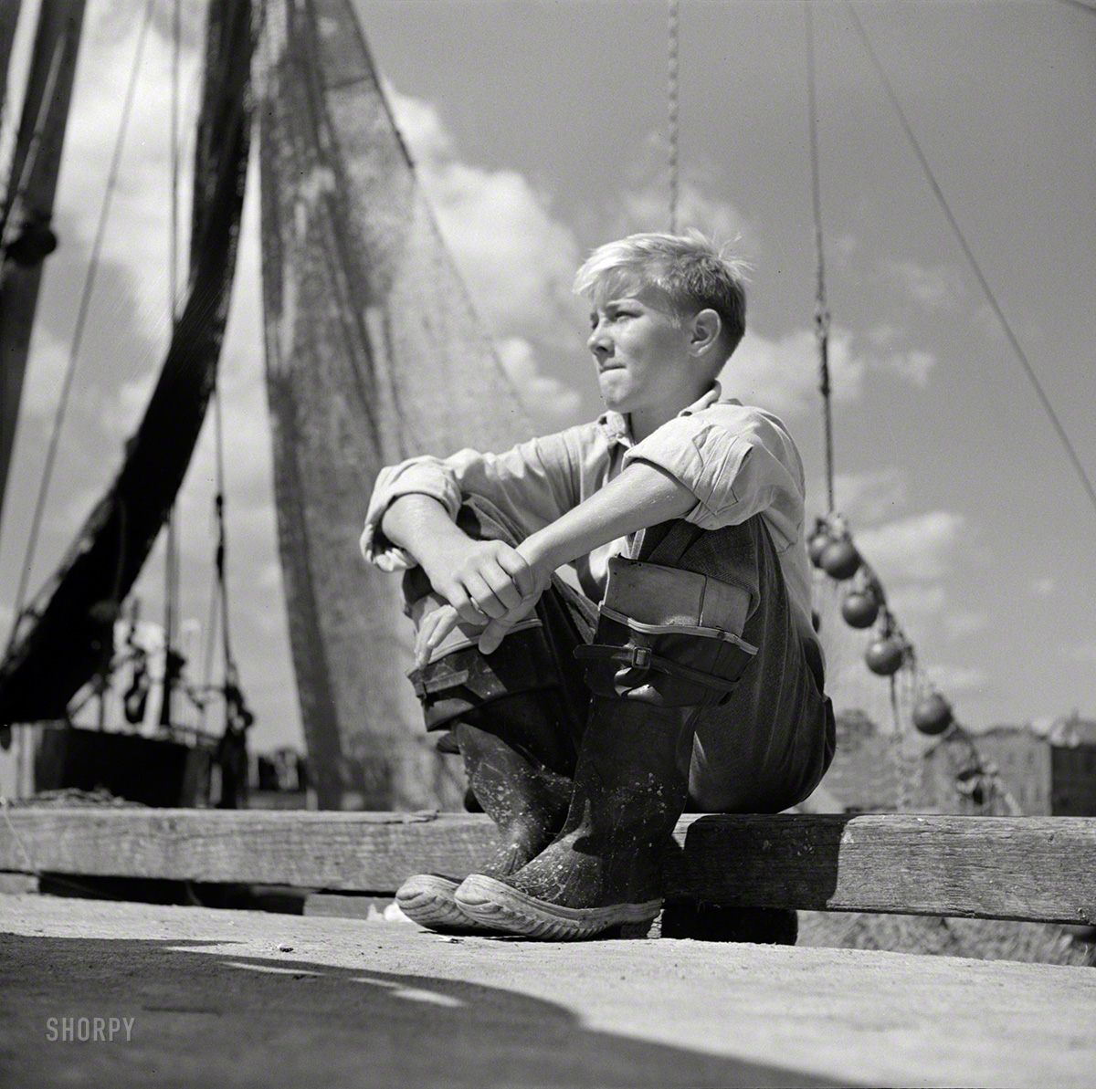 Sept. 1942. Gloucester, Mass. "A young boy, probably a fisherman of tomorrow, because many of the boys will follow their fathers as fishermen in the New England waters." Photo by Howard Liberman, Office of War Information. View full size.