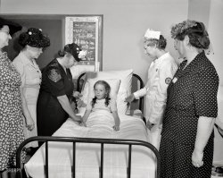 June 1944. "Brooklyn, New York. Home nursing class held at the community house of the Church of the Good Shepherd." Also: The "Basic Seven" food groups. Photo by Howard Hollem for the Office of War Information. View full size.