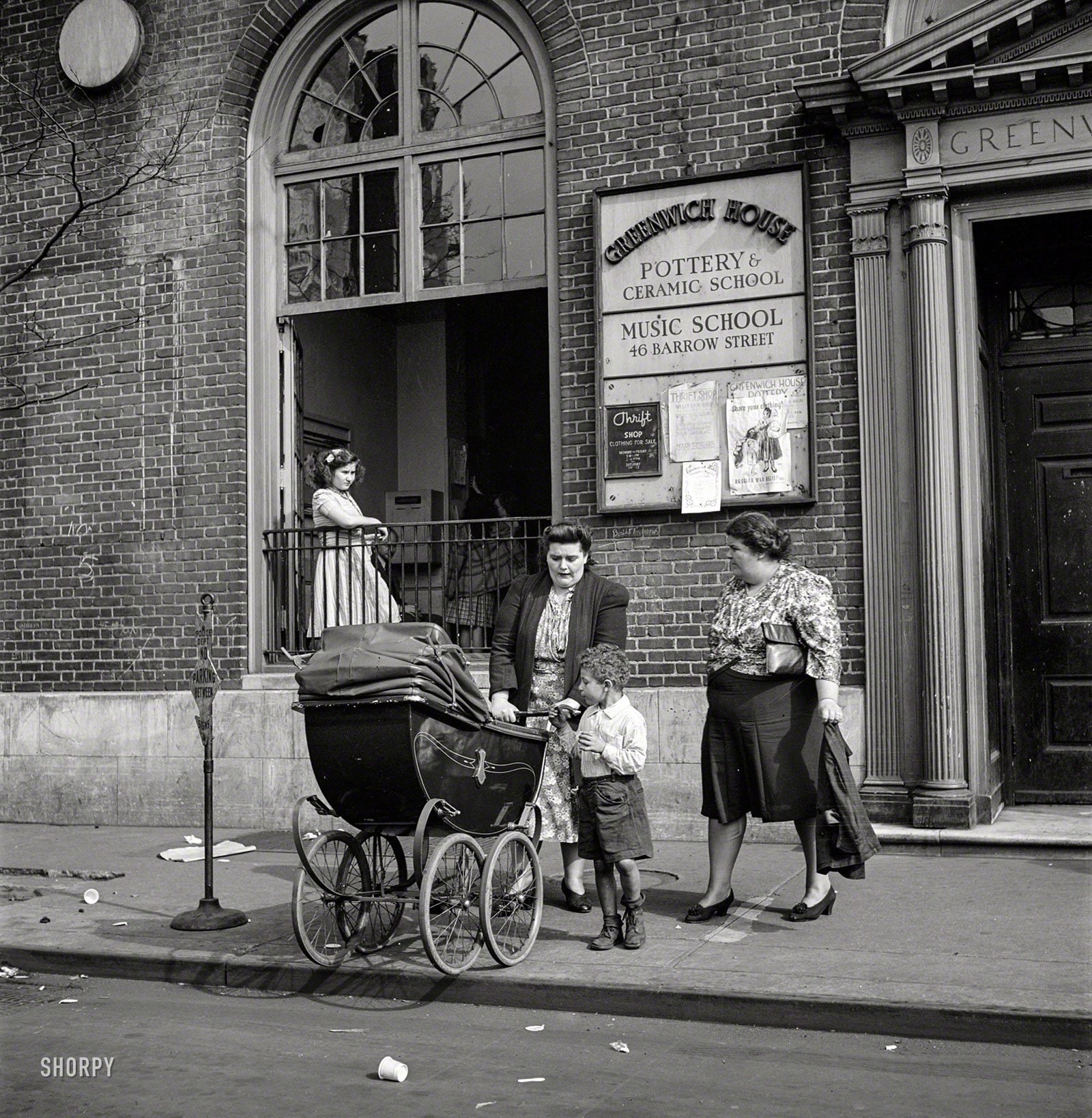 May 1944. New York. "Two working mothers calling for children at Greenwich House, a neighborhood center, where they have left them early in the morning for day care." Photo by Risdon Tillery, Office of War Information. View full size.