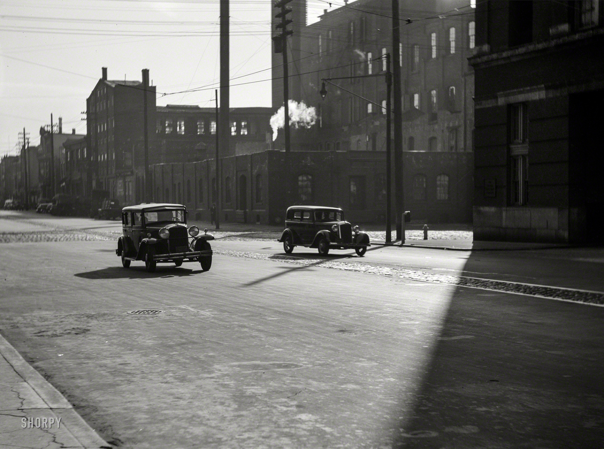 Spring 1938. "Philadelphia, Pennsylvania. Cars on South Fifth Street." Medium format nitrate negative by Paul Vanderbilt. View full size.