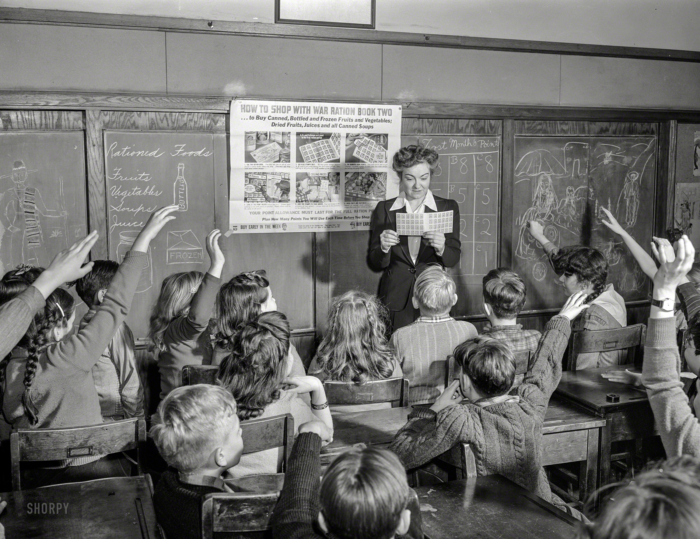 Washington, D.C., circa 1942. "Food rationing stamps. Demonstration of point rationing plan in schools." With what seem to be some tasty sides of Mexican culture. United States Office of War Information photo. View full size.