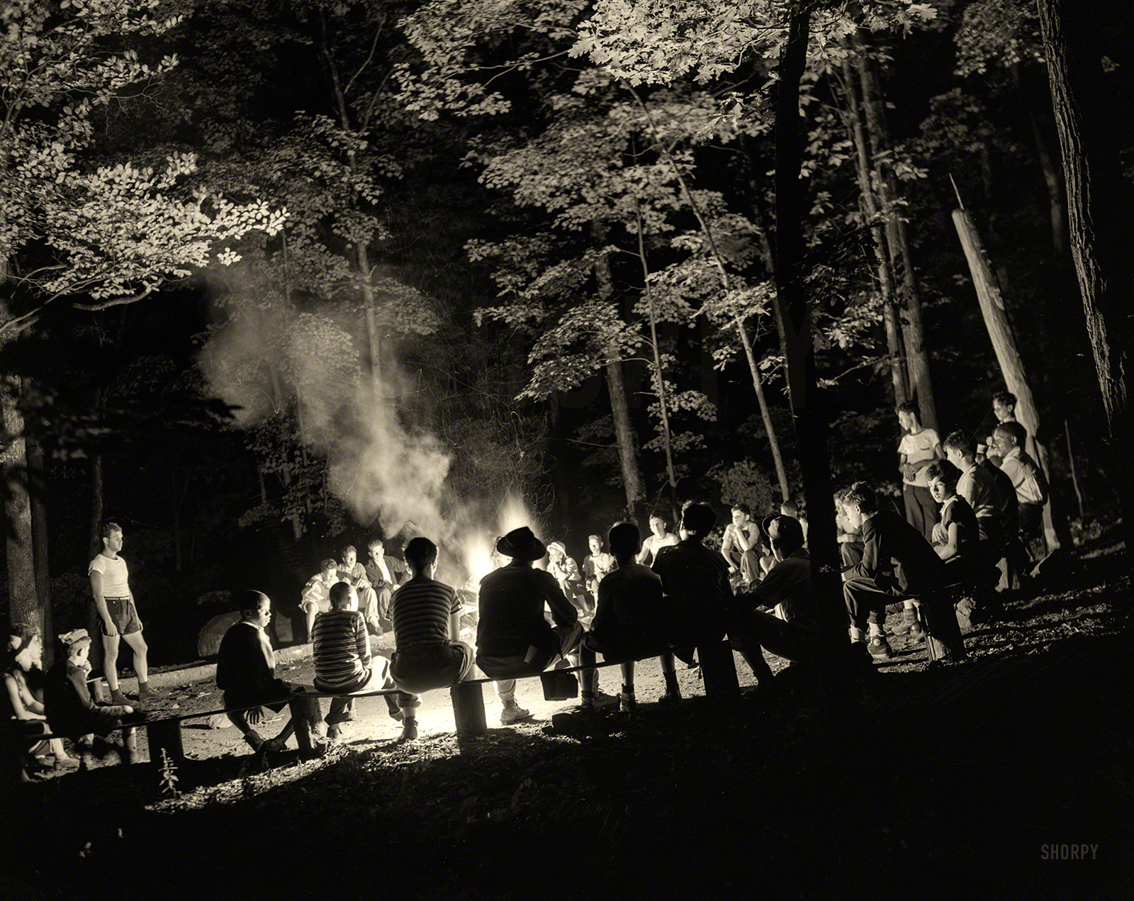 August 1943. Southfields, New York. "Interracial activities at Camp Nathan Hale, where children are aided by the Methodist Camp Service. Singing around the campfire." Photo by Gordon Parks, Office of War Information. View full size.