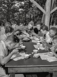August 1943. "Southfields, New York. Interracial activities at Camp Nathan Hale, where children are aided by the Methodist Camp Service. The boardinghouse reach." Photo by Gordon Parks for the Office of War Information. View full size.