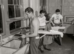 December 1943. Washington, D.C. "Servicemen using laundry facilities in the basement of the United Nations service center. It is not necessary to engage a hotel room in order to use these accommodations." Photo by Esther Bubley for the Office of War Information. View full size.