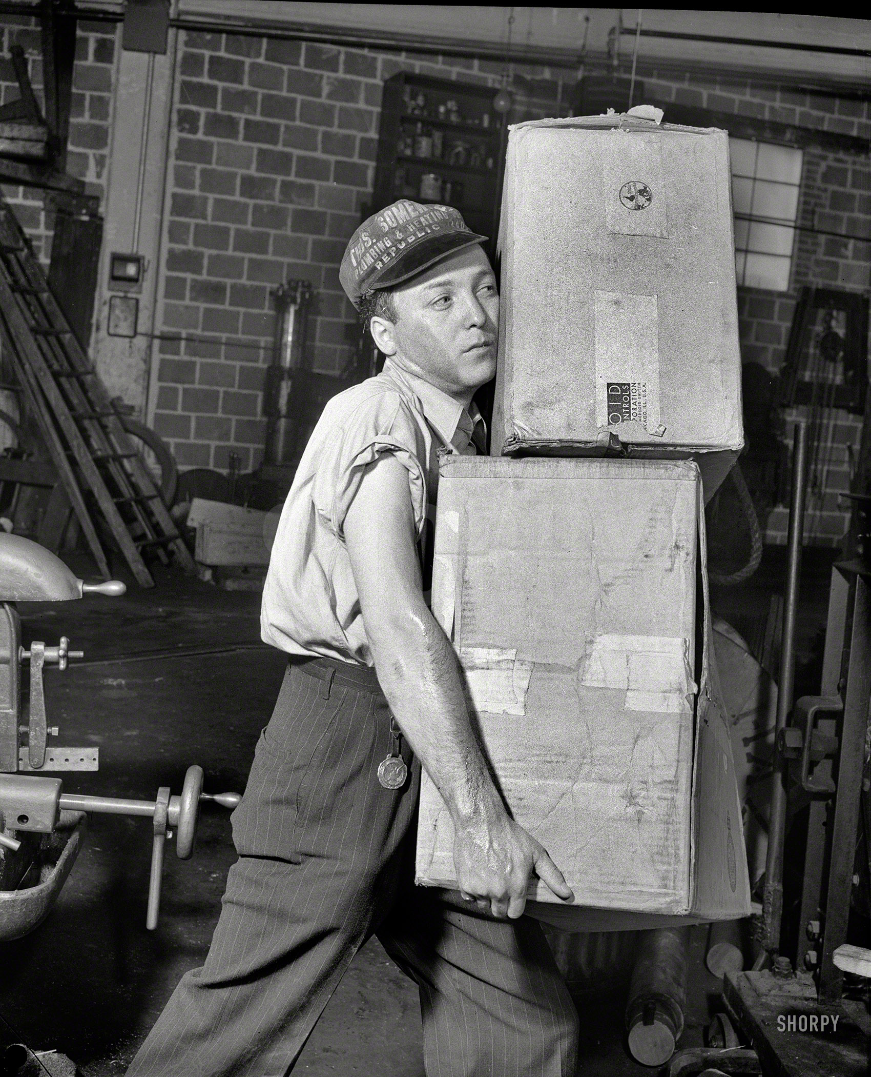 June 1942. "Industrial safety. Accident prevention. The employee who carries in such a way as to obscure his vision is not saving time -- he is endangering himself and his fellow workers. A few extra trips, or the use of a truck when necessary, eliminates possible man-hour loss from this hazard." Photo by Howard Liberman for the Office of War Information. View full size.