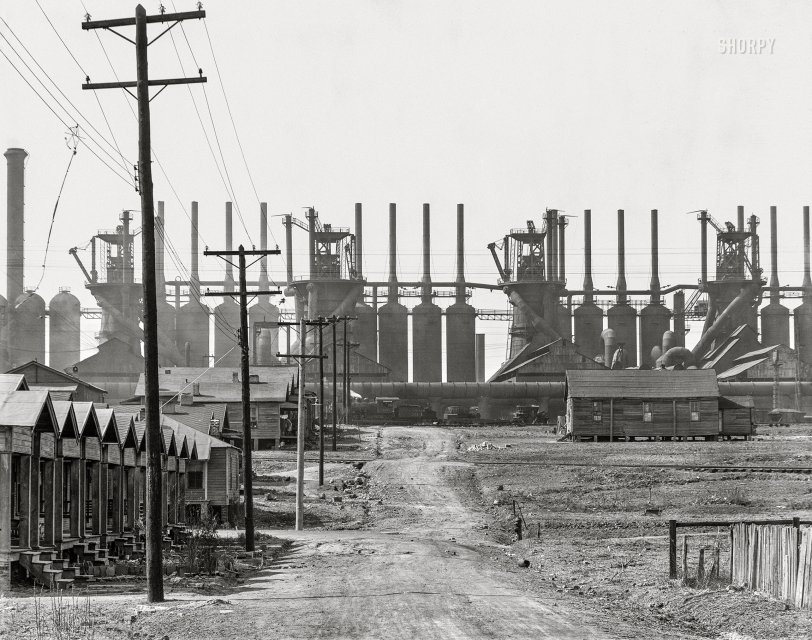 March 1936. "Steel mill and company houses -- Birmingham, Alabama." The Ensley works of the Tennessee Coal, Iron &amp; Railroad Company, along with the skeleton of a snagged kite. 8x10 inch nitrate negative by Walker Evans for the U.S. Resettlement Administration. View full size.
