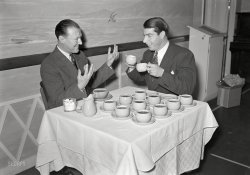 From San Francisco circa 1940 comes this uncaptioned photo of Joe DiMaggio and friend and at least a dozen cups of coffee. Who can explain what's going on here? 5x7 inch nitrate negative, photographer unknown. View full size.