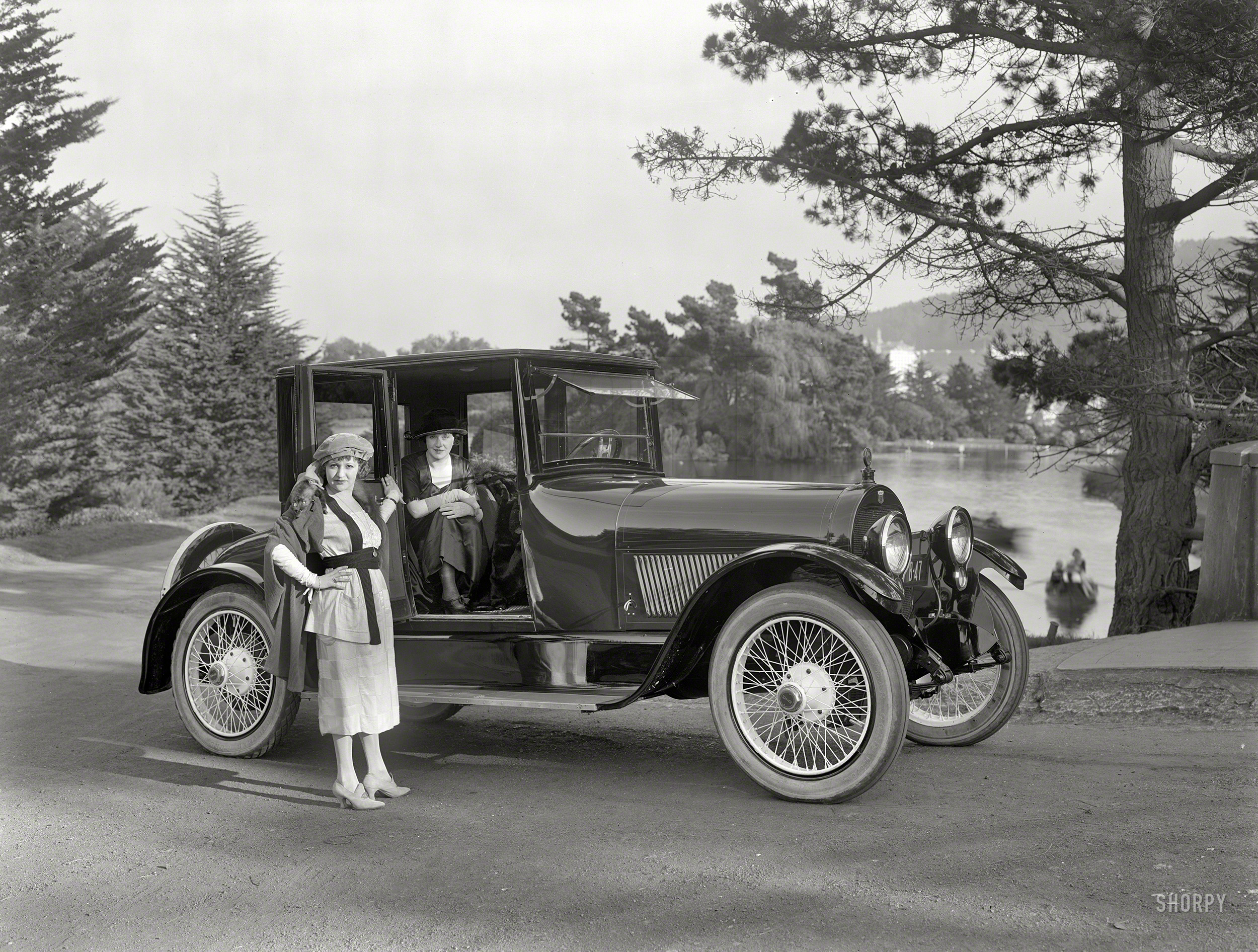 San Francisco, 1920. "Haynes four-passenger coupe." Conveying two huntresses stalking small game. 8x6 glass negative by Christopher Helin. View full size.