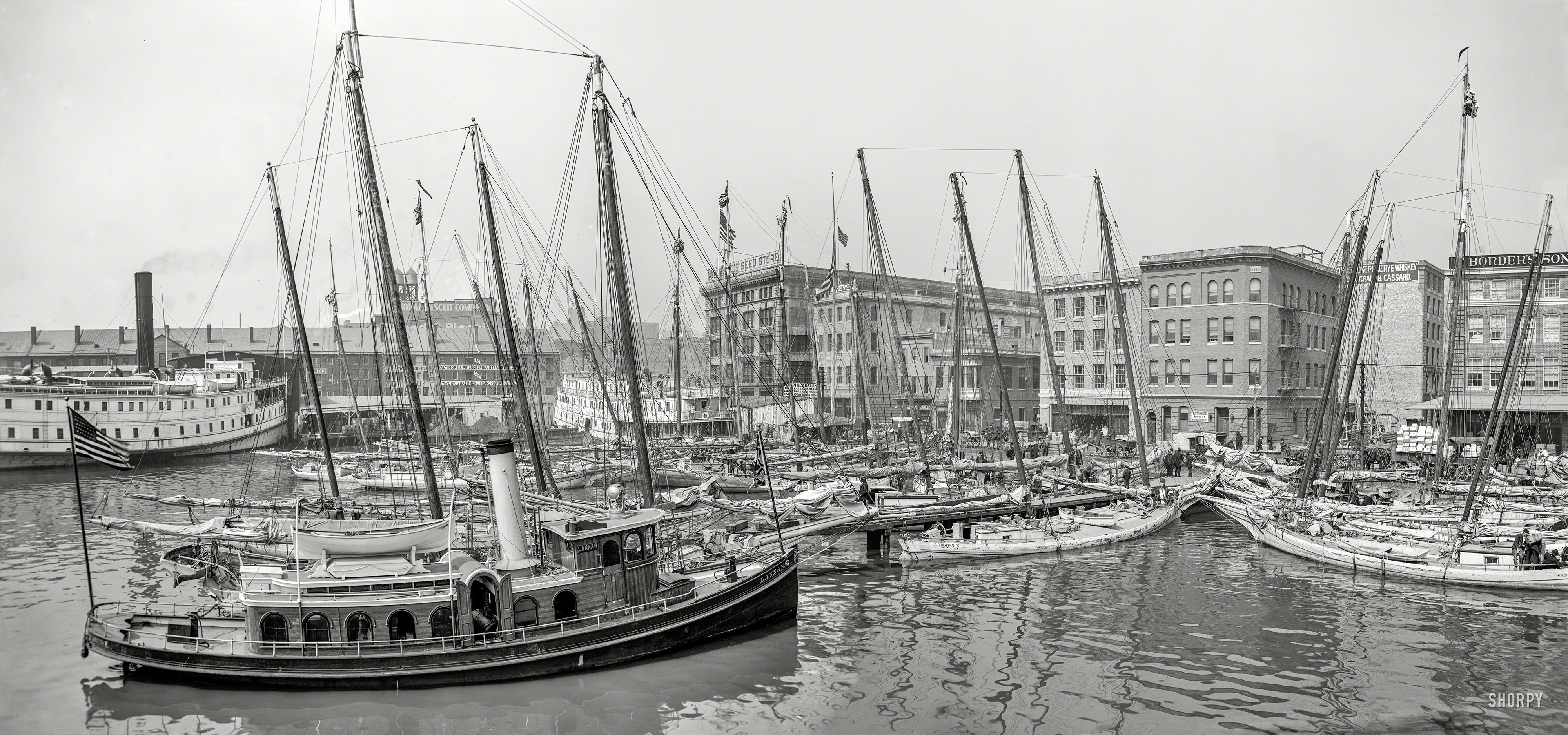Baltimore circa 1905. "Oyster luggers at the docks." Panorama made from two 8x10 inch glass negatives. Detroit Photographic Company. View full size.