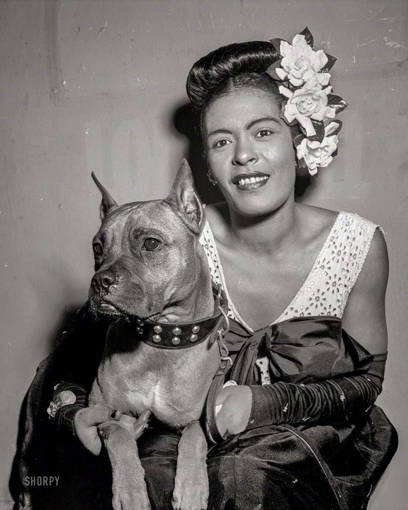 New York circa 1947. "Billie Holiday and her dog Mister at a 52nd Street jazz club." Medium format negative by William Gottlieb for Down Beat. View full size.
