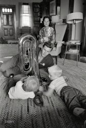 May 16, 1962. "Television actor Andy Griffith at his summer home on Roanoke Island, N.C. Photos show Griffith hugging and roughhousing with wife Barbara; at home with children Dixie and Sam, and others; with family on the beach near Albermarle Sound; deep sea fishing in the Sound; hunting with his dog; playing guitar and bass horn; plowing his field; speaking at a local beauty contest(?); signing autographs for fans; visiting the jail at Manteo, N.C." 35mm negative by Bob Sandberg for the Look magazine assignment "Andy Griffith: Sheriff of Mayberry." View full size.