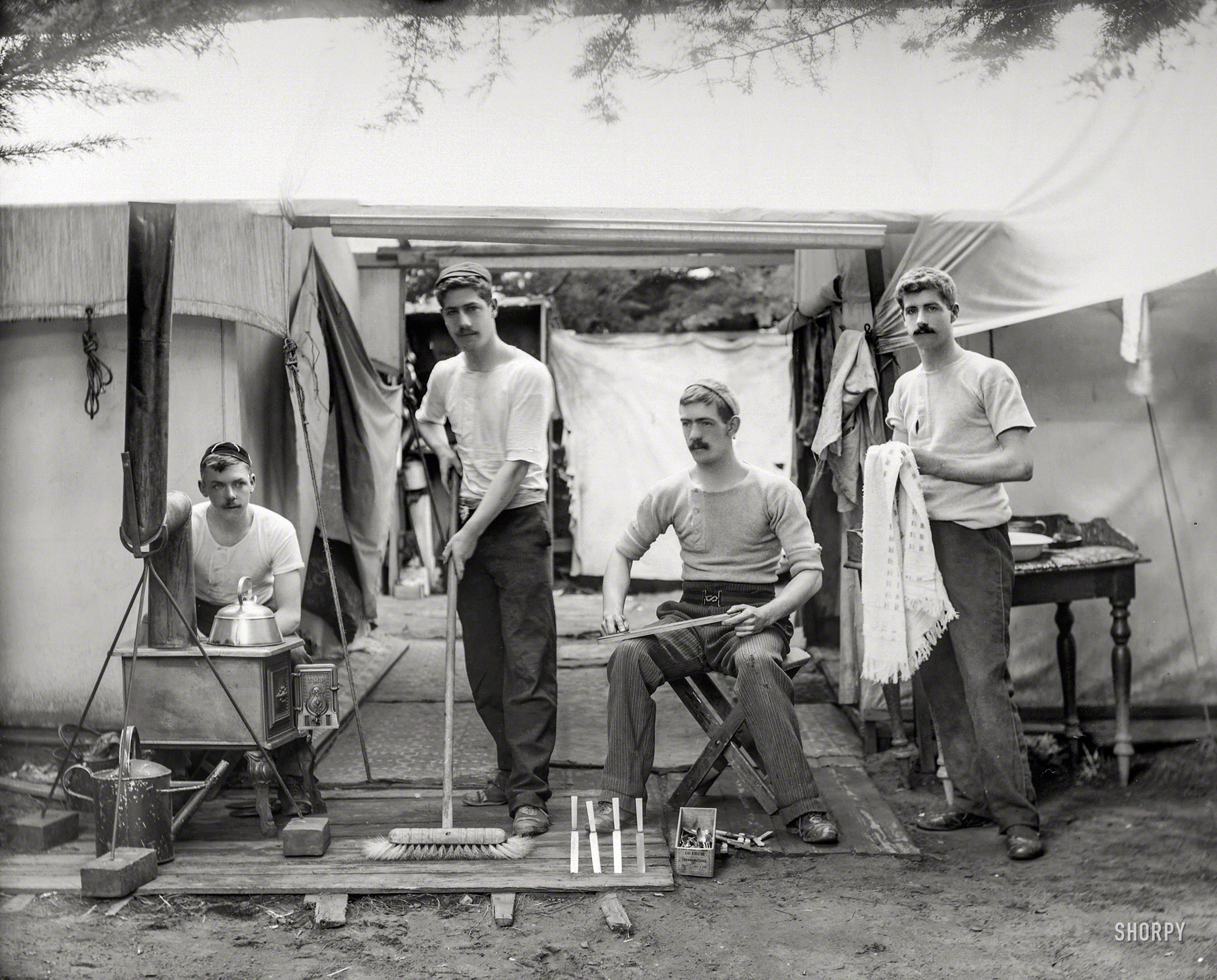 New Zealand circa 1905. "Young men doing chores, next to tent at a camp site, probably Christchurch district." Glass negative by Adam Maclay. View full size.