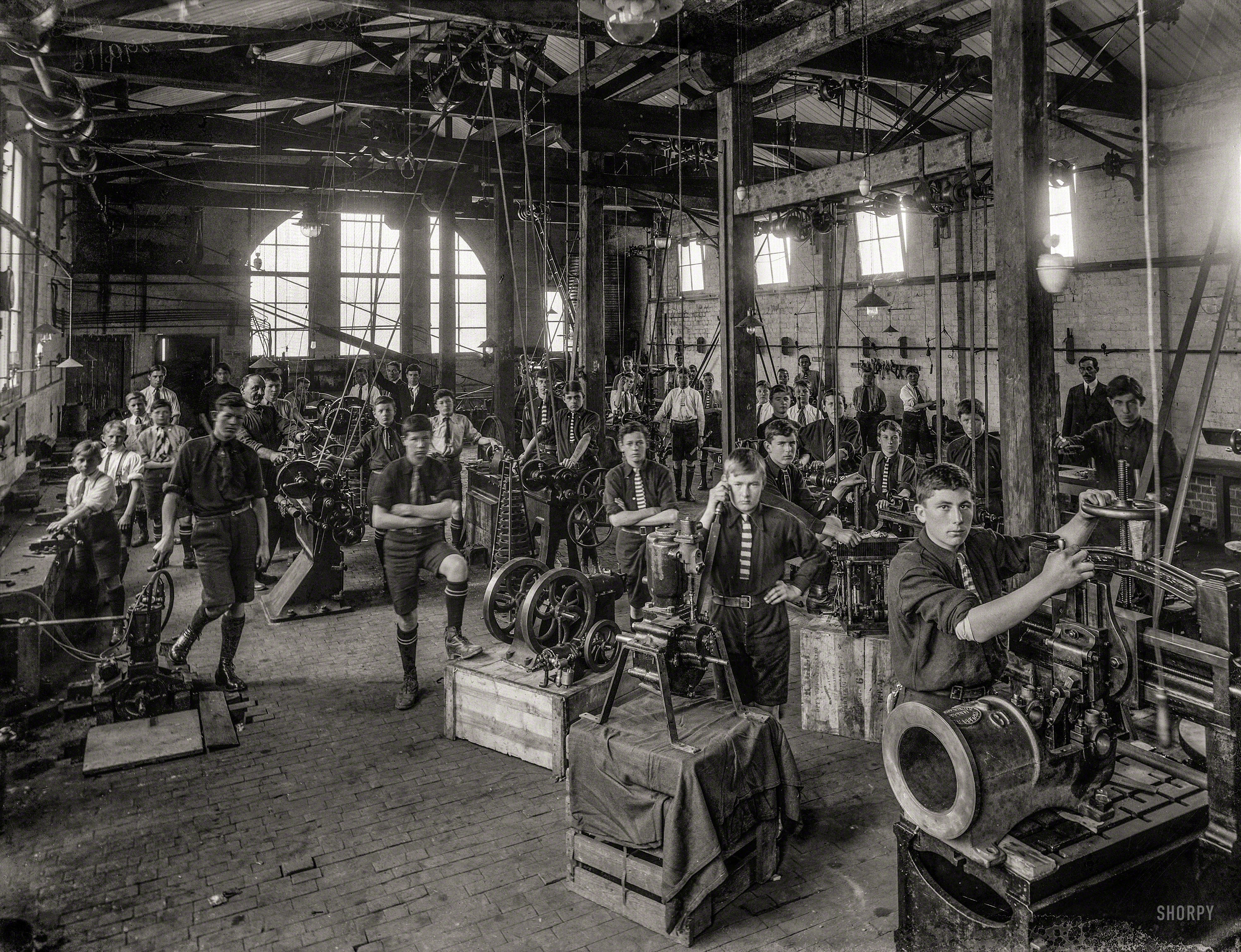 Sept. 26, 1916. "Boys of Wanganui Technical College, New Zealand, during an engineering class." Tesla Studios glass negative. View full size.