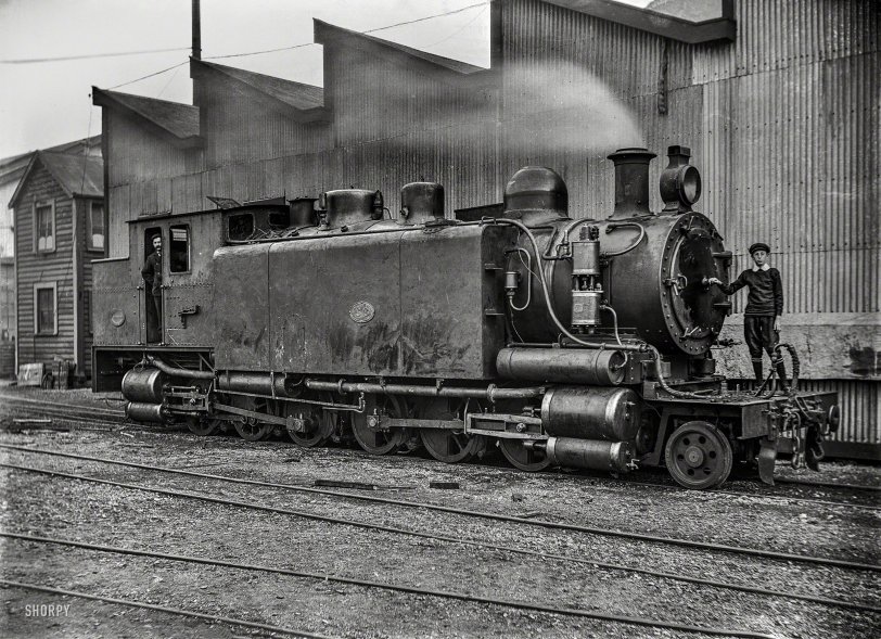 New Zealand circa 1905. "E class locomotive, E 66, at the Petone Railway Workshops, with William Godber standing on the front. Known as 'Pearson's Dream,' designed by G.A. Pearson, and built in 1905 for use on the Rimutaka Incline; written off in 1917." Glass negative by A.P. Godber. View full size.
