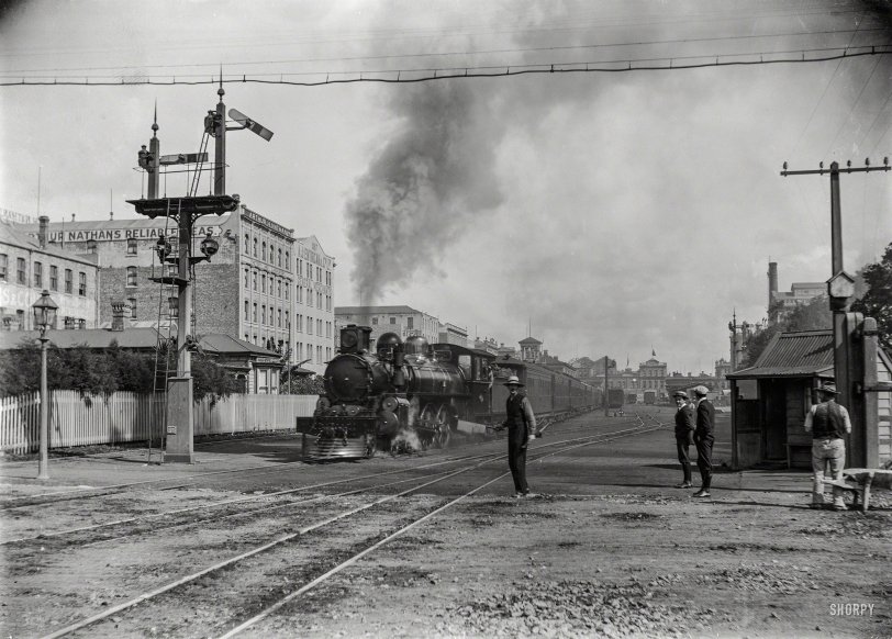 New Zealand in 1909. "The Rotorua Express leaving Auckland, alongside Customs Street East." Glass negative by A.P. Godber. View full size.
