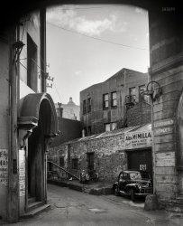 Wellington, New Zealand, circa 1957. "Bond Street, formerly known as Old Customhouse Street, photographed between 1956 and 1961 by Gordon Burt. Shows a narrow city lane." National Library of New Zealand. View full size.