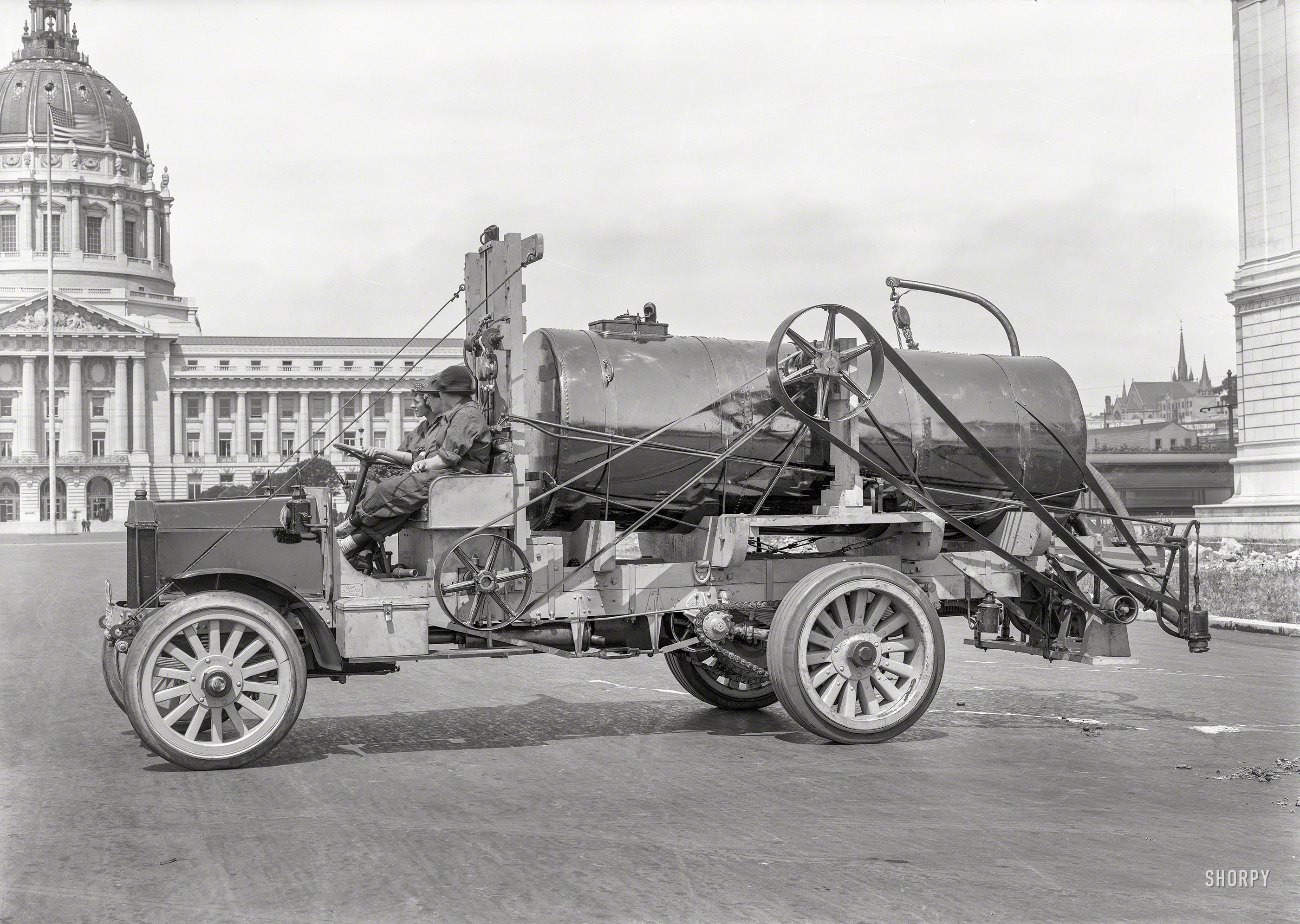 San Francisco City Hall circa 1919. "Peerless truck." Three young ladies aboard what seems to be some sort of street-cleaning, finger-ripping machine. Hide your children and stand clear! 5x7 glass negative by Christopher Helin. View full size.