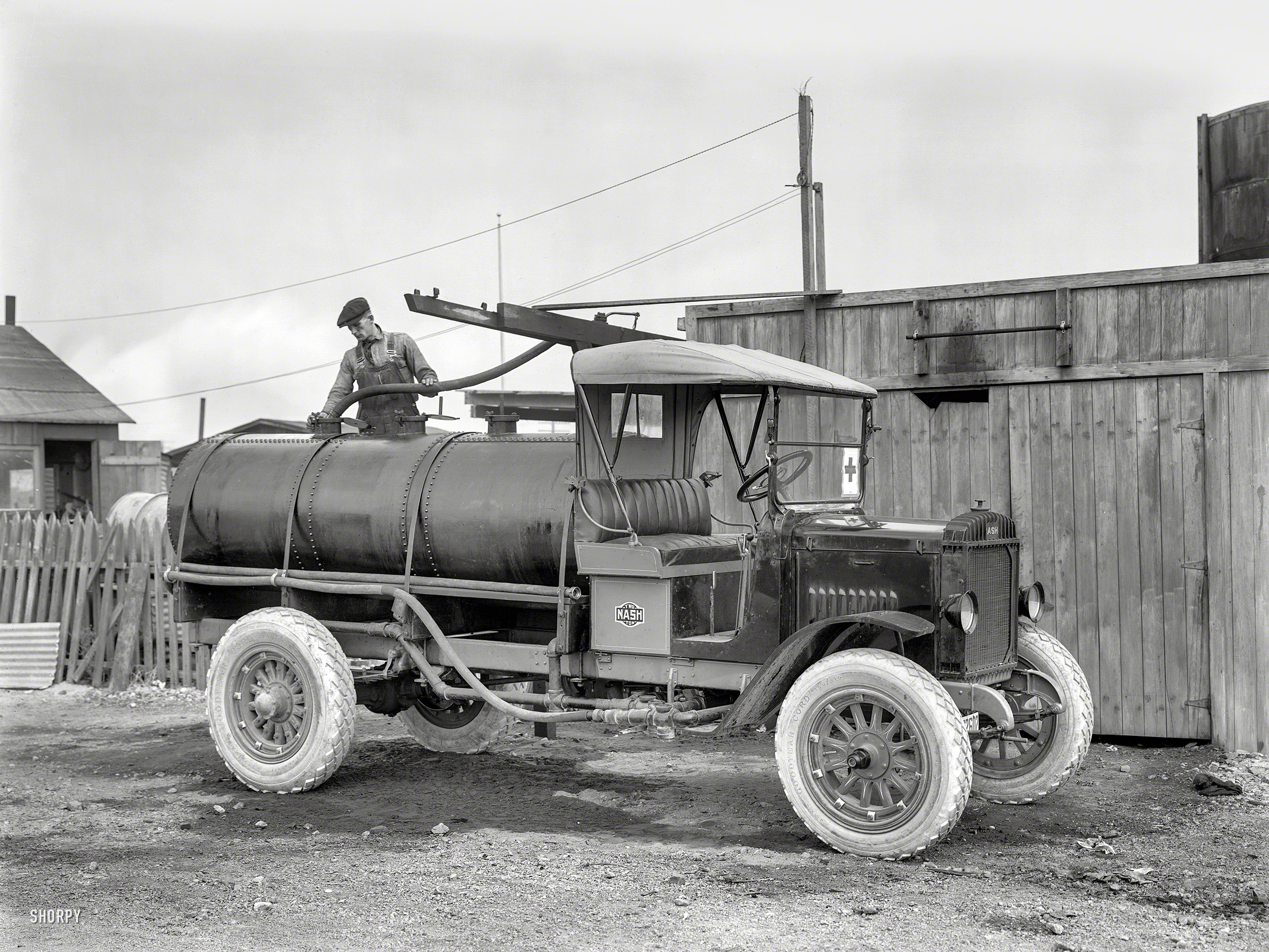 &nbsp; &nbsp; &nbsp; &nbsp; The flushing of streets by sprinkler trucks was a widespread if not terribly effective public-health measure during the "Spanish influenza" epidemic of the late teens.
San Francisco circa 1919. "Nash Two-Ton Tanker Truck." This begins a new series of photos, scanned by Shorpy from large-format negatives taken by or for Christopher Helin, travel and automotive editor of the San Francisco Examiner from about 1915 to 1930. 8.5 x 6.5 inch glass plate. View full size.