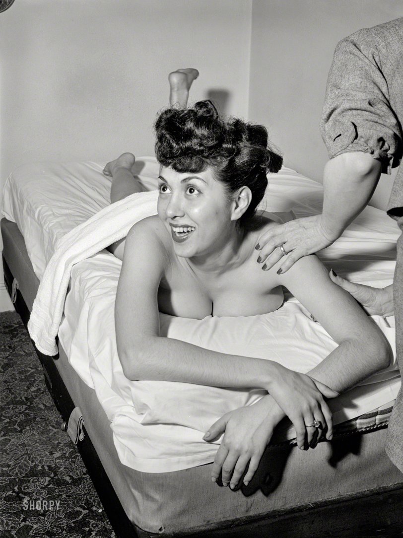 April 1947. New York. "Chirp discusses life while getting a massage" is the caption for this revealing photo of the unjustly obscure jazz singer Gloria King. Medium format negative by William Gottlieb for Down Beat. View full size.
