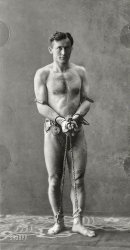 Circa 1900. "Harry Houdini (1874-1926), full-length portrait, standing, in chains." McManus-Young Collection, Library of Congress. View full size.
