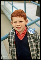 "10/9/65. New York World's Fair. Young redheaded son of Mr. John Semenya of Yonkers, N.Y." 35mm Ektachrome taken by an unknown photographer at the Chrysler pavilion with a Miranda Model D. View full size.